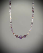 Луксозна дамска гривна от рядък камък Мелодит (Super Seven) с фасетирани кристали и елементи от медицинска стомана. Артефакт за духовно пробуждане от колекция Lemurian Bloodline на House of Astrology.